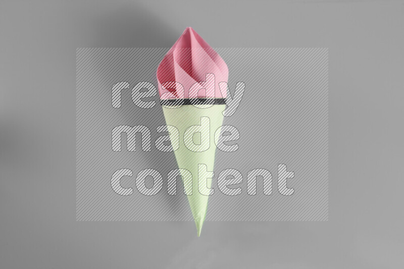 Origami ice cream on grey background