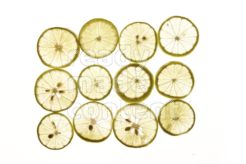 Lemon slices on illuminated white background