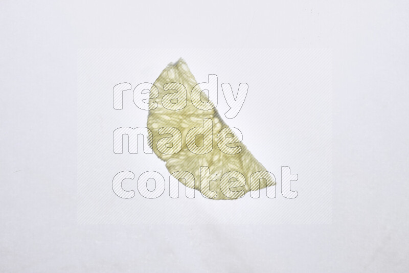 Orange slices on illuminated white background