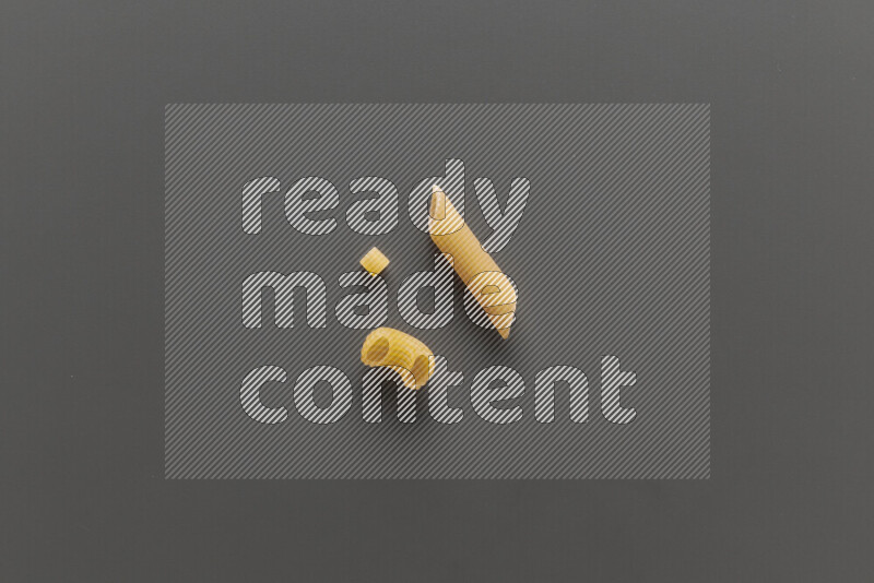 Different pasta types on grey background