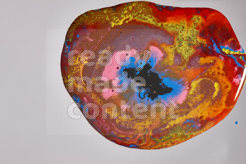 Close-ups of assorted colors blending on a grey background