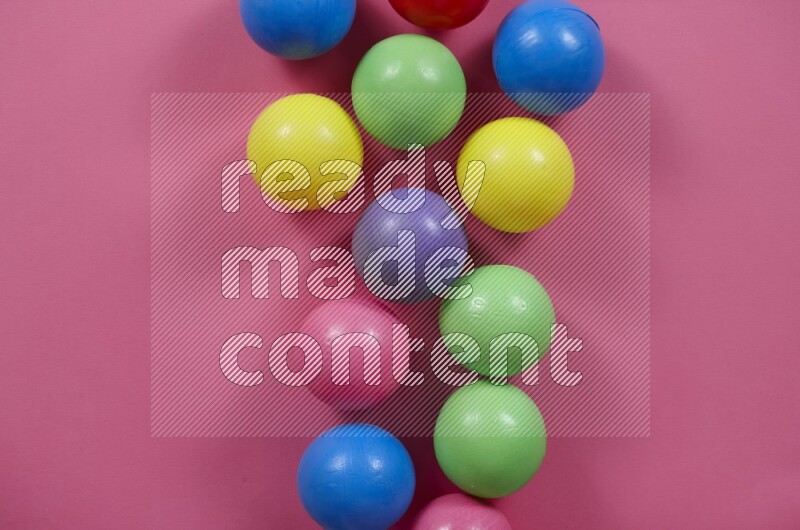 Multicolored plastic balls on different colored backgrounds (kids toys)