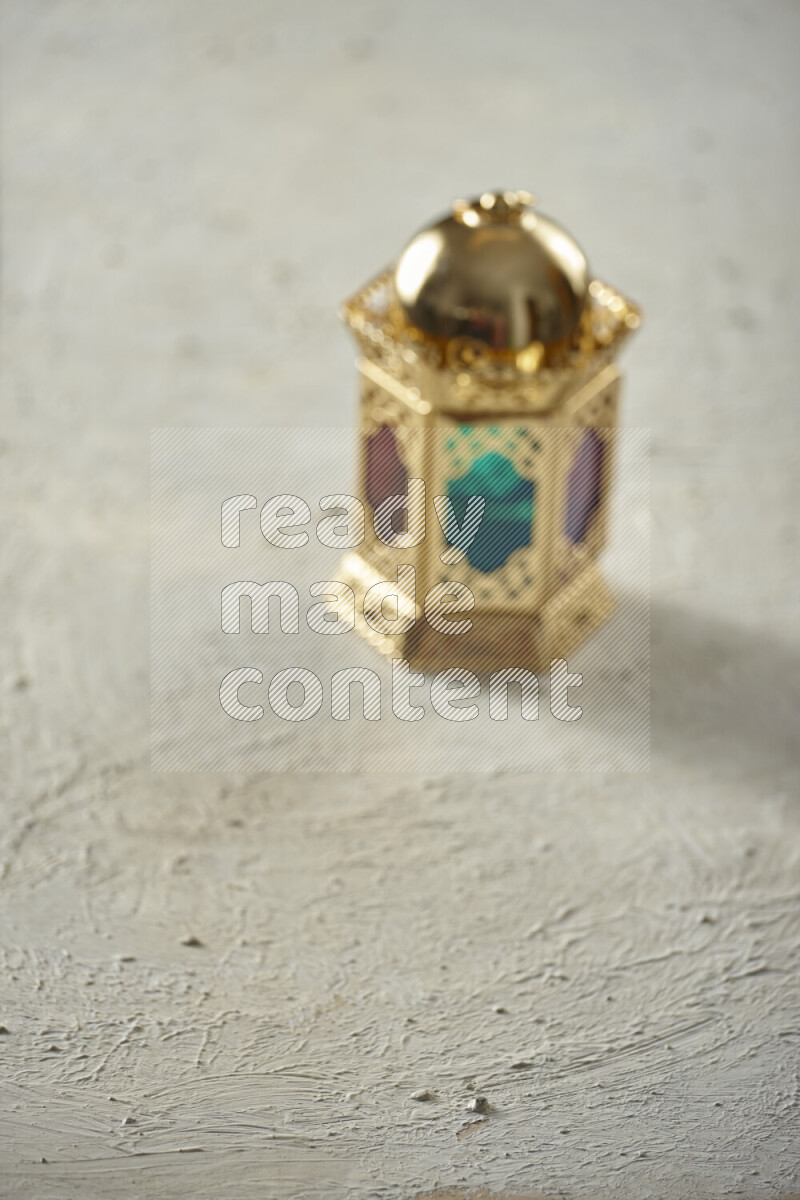 A lantern placed on a textured white background