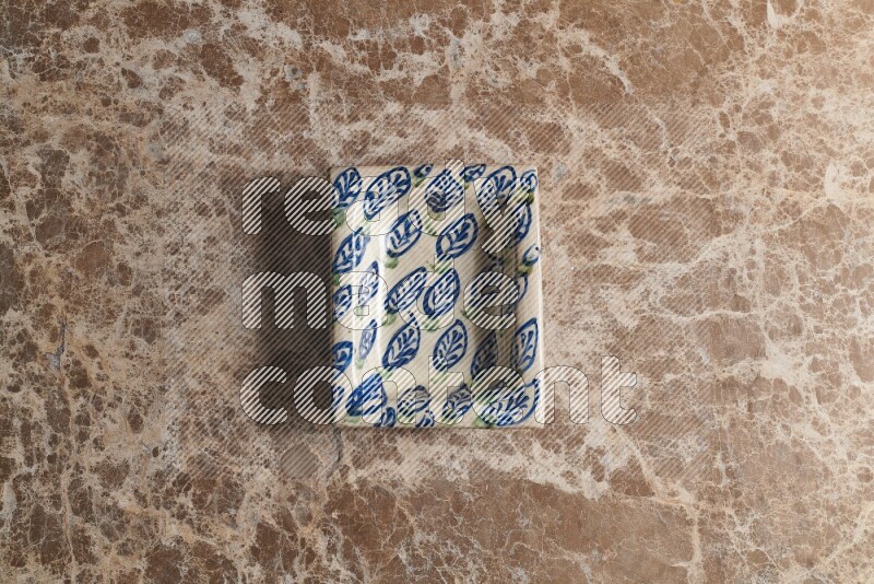 A decorative pottery plate on beige marble background