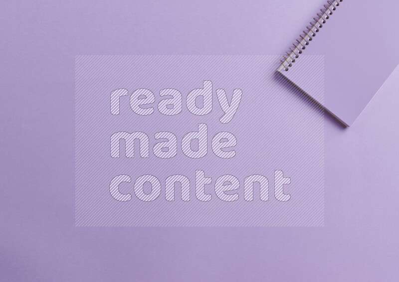 A purple notebook on purple background