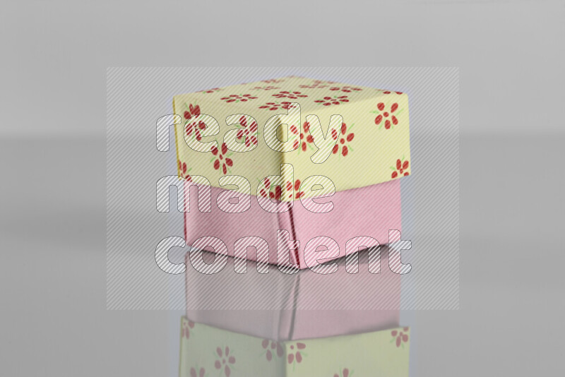 Origami gift box on grey background