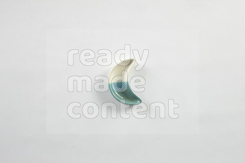 A pottery crescent plate on white background