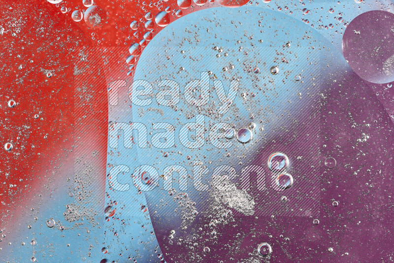 Close-ups of abstract oil bubbles on water surface in shades of blue, red and purple