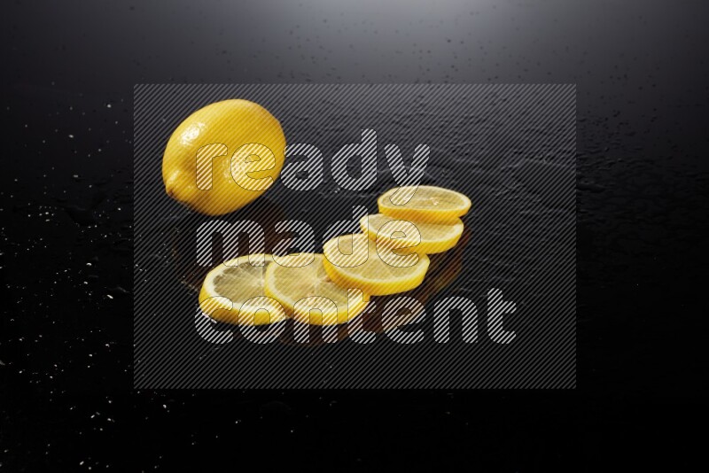 Lemon slices with water drops, and droplets on black background