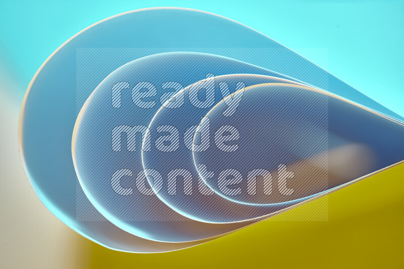 An abstract art of paper folded into smooth curves in blue and yellow gradients