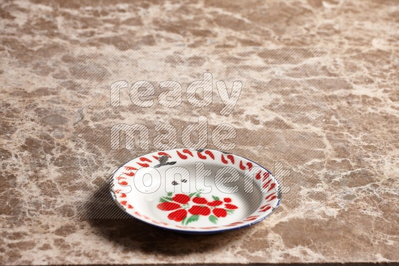 A vintage metal plate on beige marble background