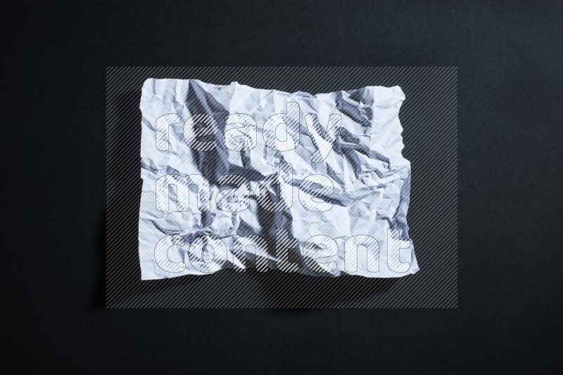 White paper sheet on black background