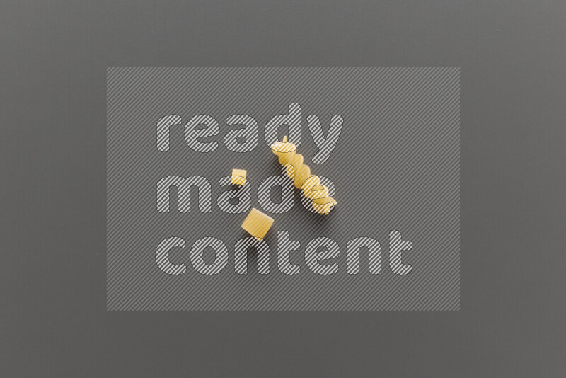 Different pasta types on grey background