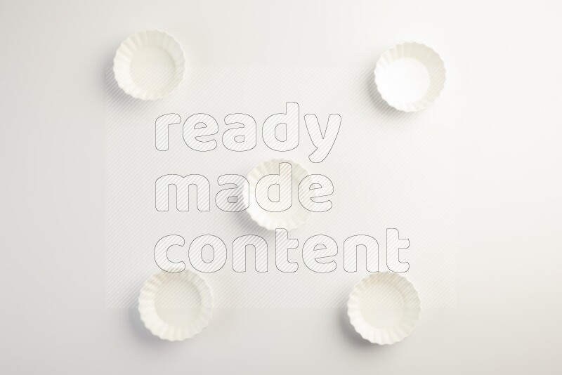 white ceramic round sauce dish on white countertop