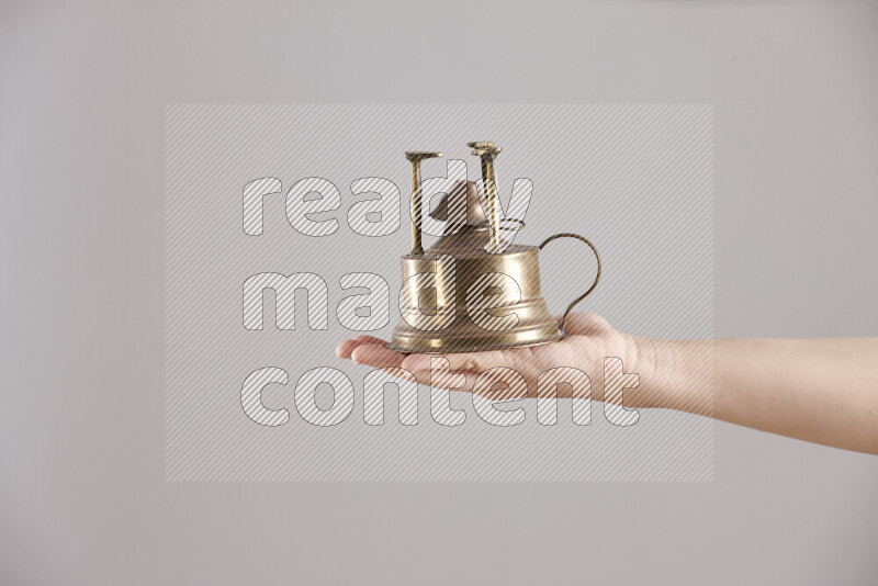 Woman hands holding different metal essentials in different positions