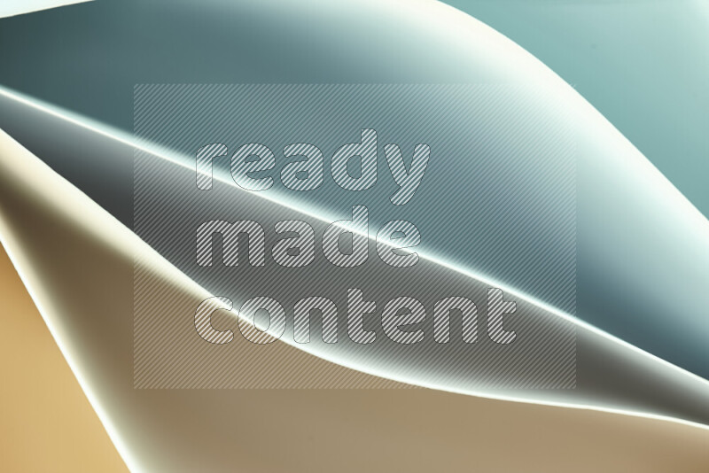 This image showcases an abstract paper art composition with paper curves in green and orange gradients created by colored light