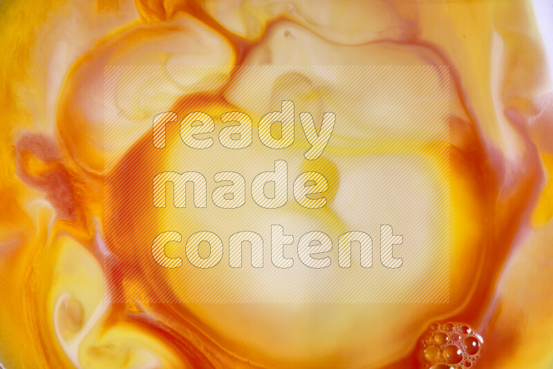 A close-up of abstract swirling patterns in orange, red and white