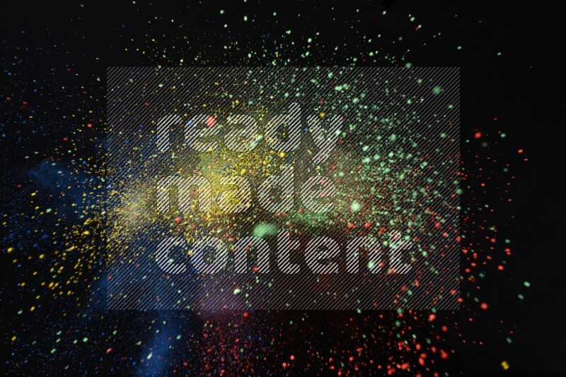 Colorful powder explosion on black background