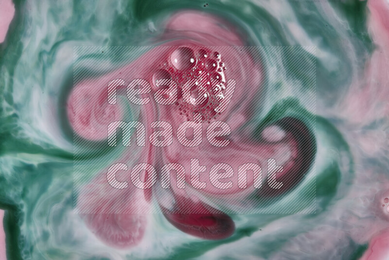 صورة مقربة لأنماط دوامية مجردة باللون الأحمر والأخضر