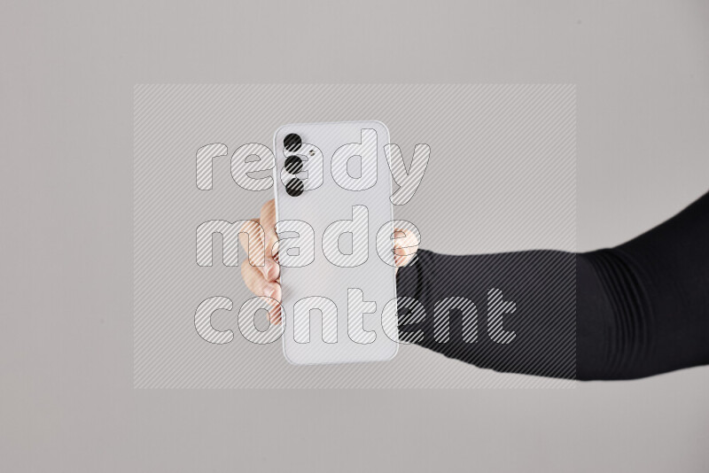 Woman hands holding different mobile phones in different positions