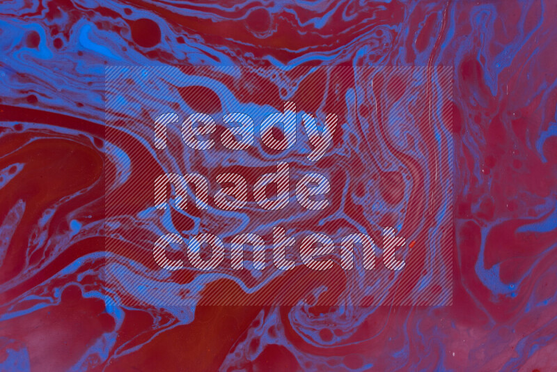 The image depicts a marbling effect with swirling patterns of red and blue