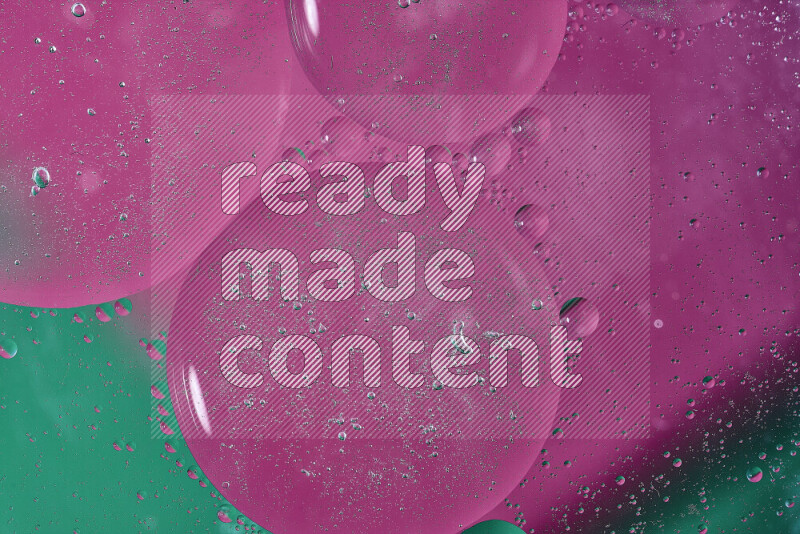 Close-ups of abstract oil bubbles on water surface in shades of green and pink