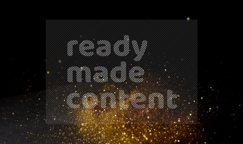 Gold glitter powder isolated on black background