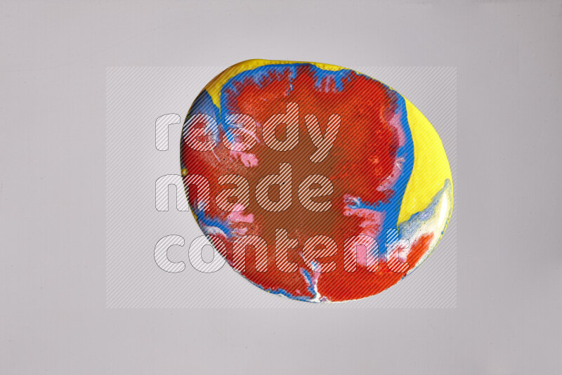 Close-ups of assorted colors blending on a grey background