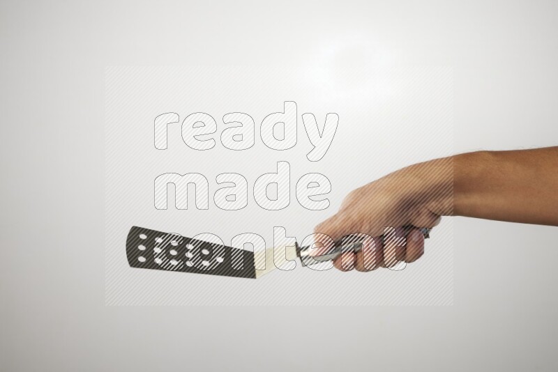 Male Hand Holding Burger Flipper on white background