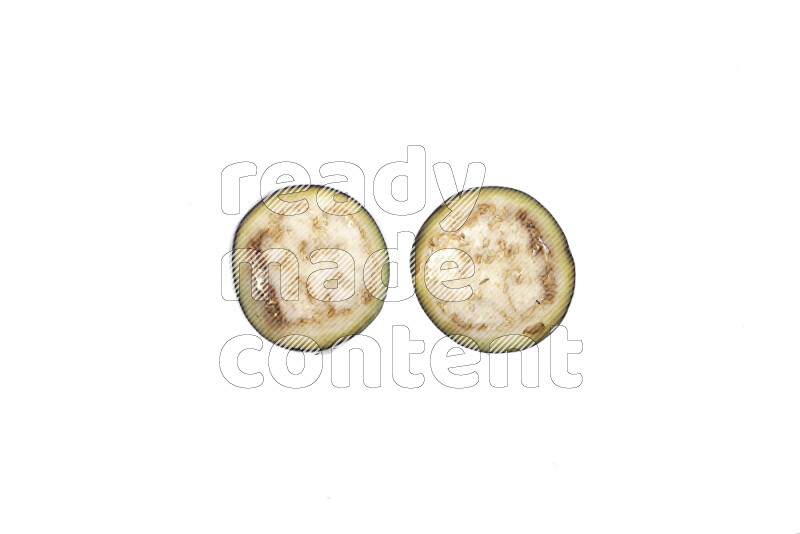 Eggplant slices on illuminated white background
