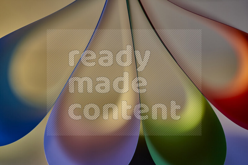 An abstract art piece displaying smooth curves in colorful gradients created by colored light