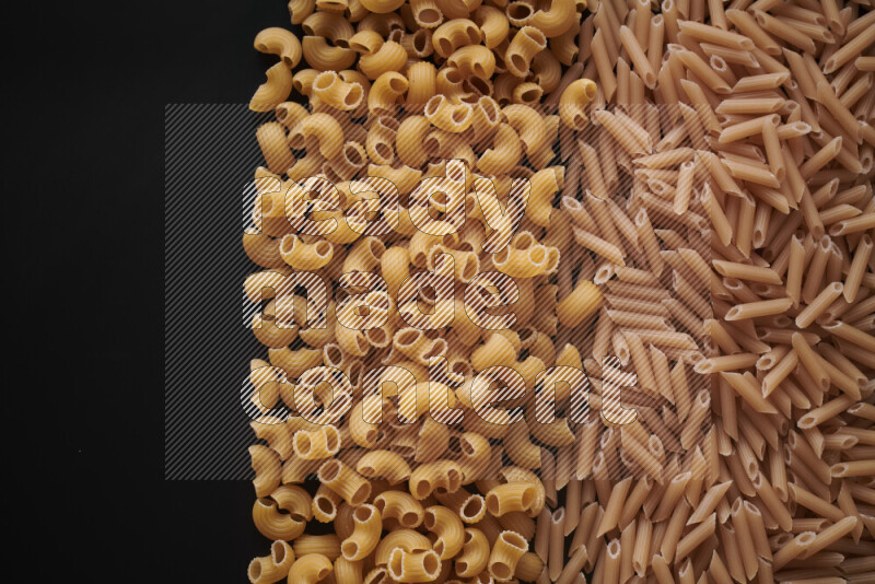 Different pasta types on black background