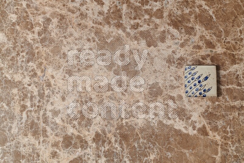 A decorative coaster on beige marble background