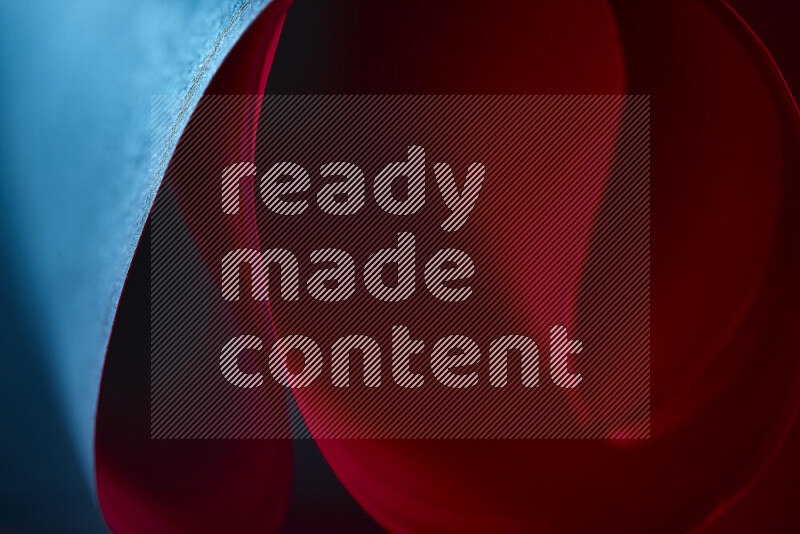 An abstract art piece displaying smooth curves in blue and red gradients created by colored light