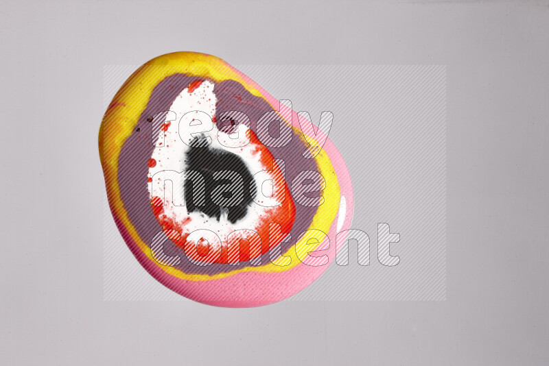 Close-ups of assorted colors blending on a grey background