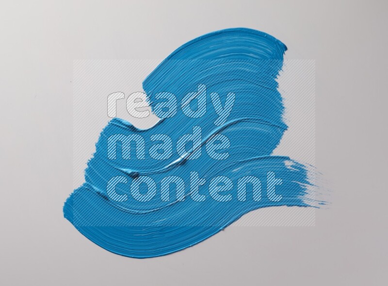 Multi blue curved brush strokes shaped into different shapes on a white background