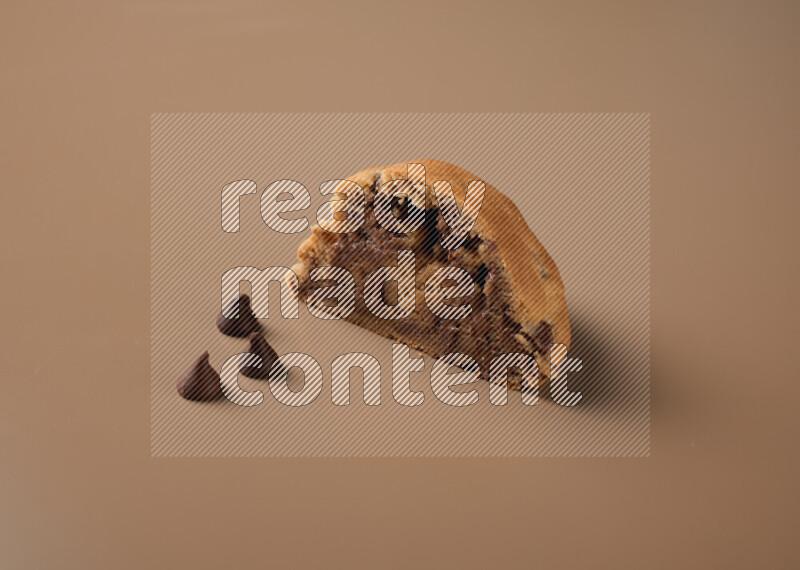 a cookie cut in half on a brown background
