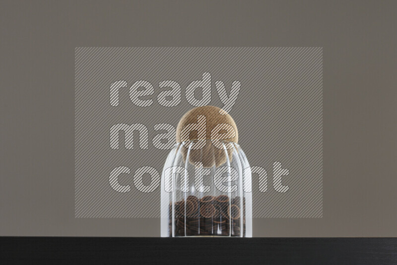 Buttons in a glass jar on black background