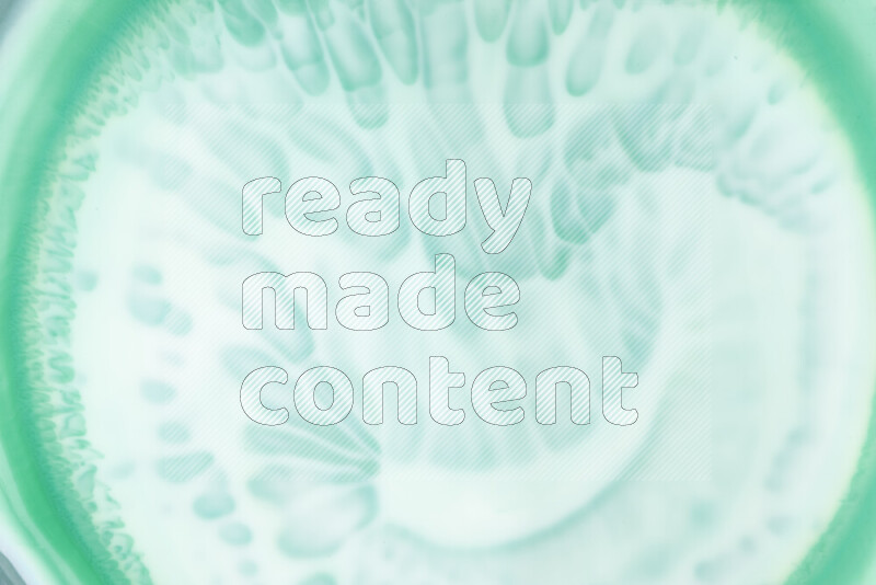 لقطة مقربة لأنماط دوامية بتدرجات اللون الأخضر