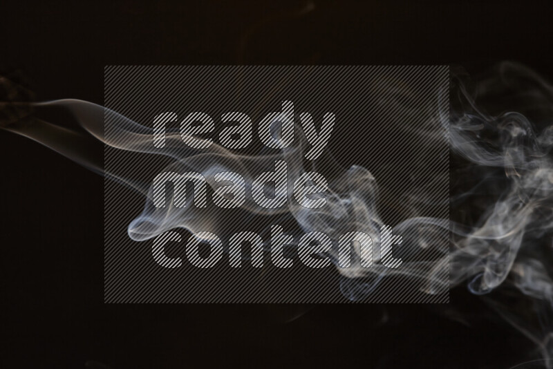 Motion of wavy smoke isolated on dark background