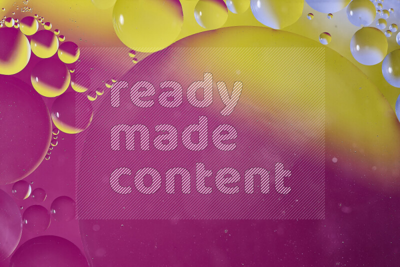 Close-ups of abstract oil bubbles on water surface in shades of yellow and pink