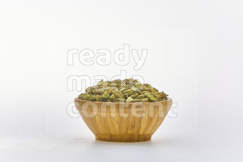 Cardamon in a container on white background