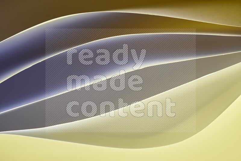 This image showcases an abstract paper art composition with paper curves in gold gradients created by colored light