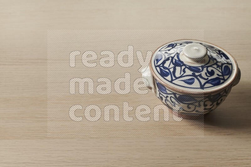 Multicolored Pottery Pot on Oak Wooden Flooring, 45 degrees