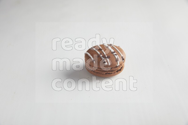 45º Shot of Brown white Chocolate Caramel macaron on white background