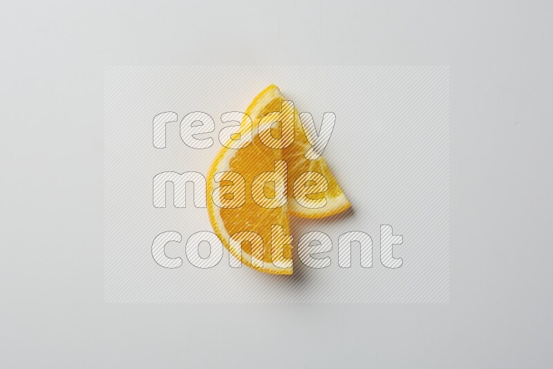 Two halves of an orange slices on white background
