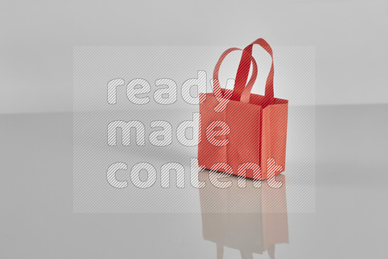 Origami shopping bag on grey background
