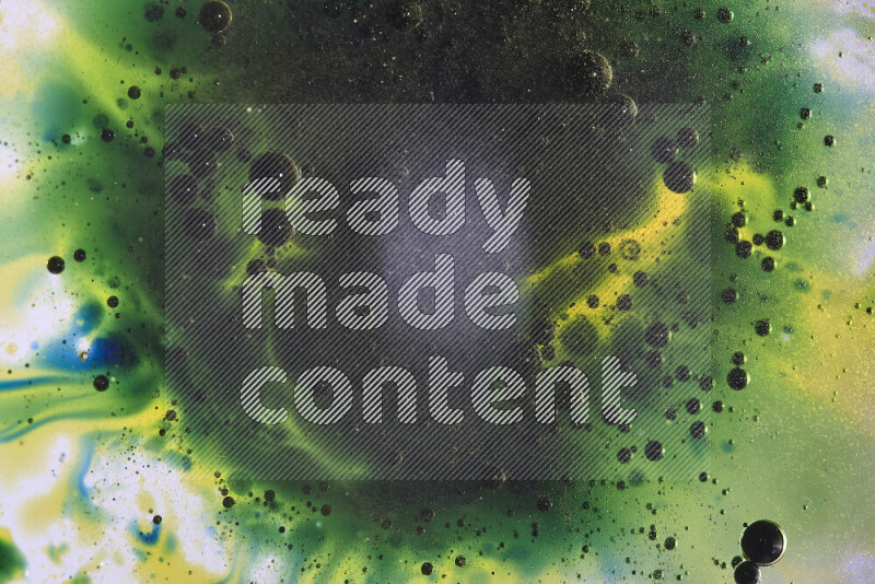 Close-ups of abstract yellow, blue and green watercolor drops on oil Surface on white background