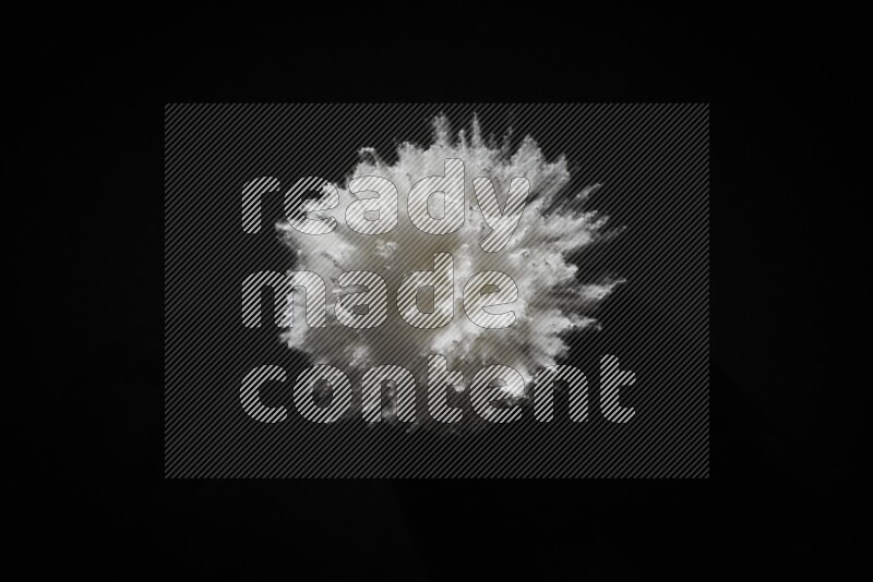 White powder explosion on black background