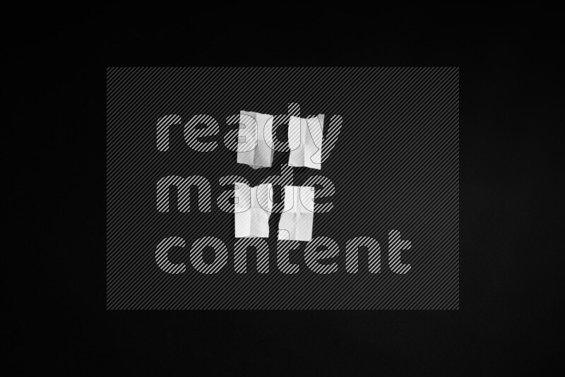 Ripped notebook sheet on black background